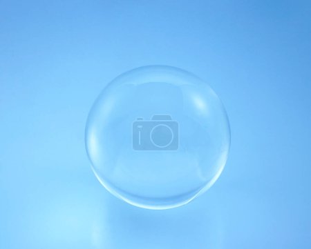 glass ball on blue background.