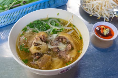 Top view of famous local traditional Vietnamese food - Pho soup noodles