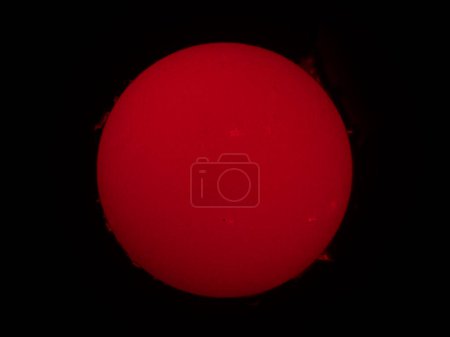 Real view of the Sun in a narrow alpha spectrum with prominences in a special Coronado telescope