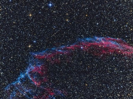 the eastern veil in space among the stars and a large amount of cosmic dust and gas at a great distance from us. Taken with a telescope at a long exposure