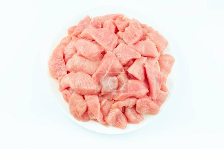 Fresh frozen pieces of turkey meat on a white background.Raw chicken.Frozen chicken fillet..Ogranic food and healthy eating.frozen turkey or poultry meat.