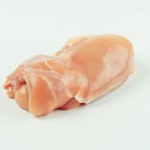 Skinless chicken meat.Raw fresh skinless chicken leg and thigh meat on a white background.Copy space.Food for retail.Ogranic food,healthy eating.Food concept.Top view.