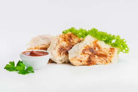 Photo for Chicken fillets fried until half cooked, semi-finished product with fresh herbs on a white background. Fast cooking.Fast homemade food.Fast food. Quick cooking at home. Copy space. - Royalty Free Image