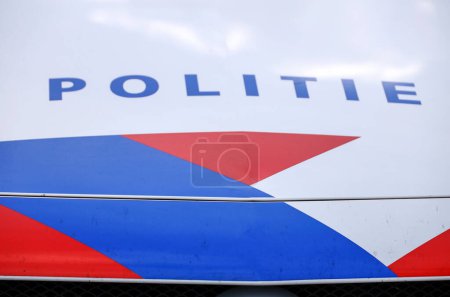 Photo for Logo and striping of the Dutch police (politie) on patrol car in the Netherlands - Royalty Free Image