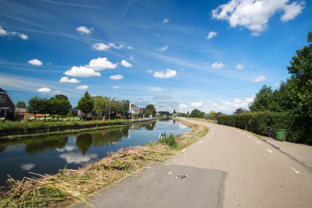 Photo for Ring canal of the Zuidplaspolder along Nieuwerkerk Noord in Nieuwerkerk aan den IJssel in the Netherlands - Royalty Free Image