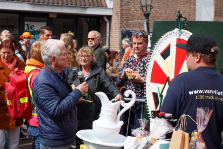 Photo for Street garage sales, music, games and celibration during King's day in Nieuwerkerk aan den IJssel in the Netherlands - Royalty Free Image