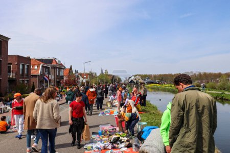Photo for Street garage sales, music, games and celibration during King's day in Nieuwerkerk aan den IJssel in the Netherlands - Royalty Free Image