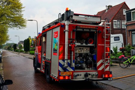 Photo for Fire truck of the Nieuwerkerk aan den IJssel fire brigade at an incident in Zuidplas - Royalty Free Image