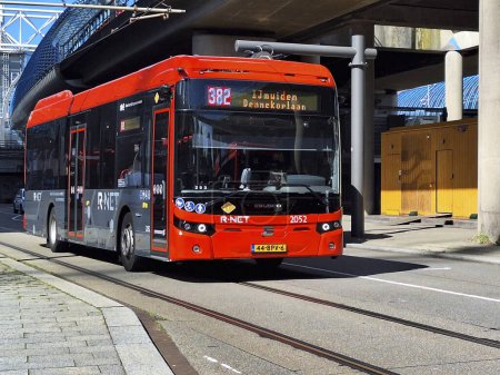 Photo for Black and red Ebusco 2.2  buses of Connexion in R-Net colors at Amsterdam Sloterdijk in the Netherlands - Royalty Free Image