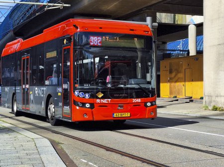 Photo for Black and red Ebusco 2.2  buses of Connexion in R-Net colors at Amsterdam Sloterdijk in the Netherlands - Royalty Free Image