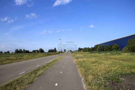 Photo for Pastures with farms and roads in the future Fifth Village of the Zuidplaspolder of the municipality of Zuidplas in the Netherlands - Royalty Free Image