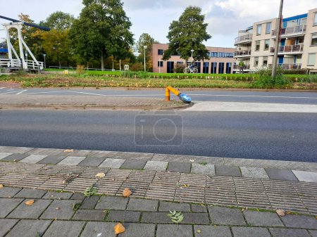 Photo for Flattened bollard on the central reservation of a road in Nieuwerkerk aan den IJssel Netherlands - Royalty Free Image