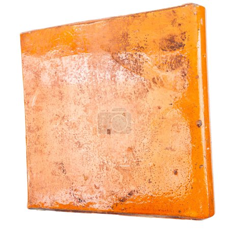 Old orange glazed furnace tile isolated on white background