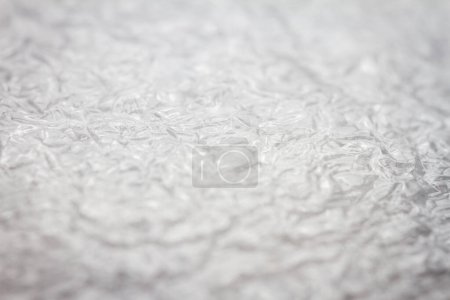 Extreme macro of plastic bubble wrap texture. Selective soft focus, shallow depth of field. Abstract dreamy background
