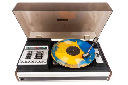 Vintage turntable record player with blue and orange vinyl isolated on white background.