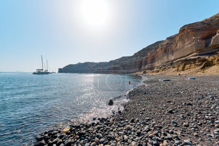 View of the black sand beach (Mesa Pigadia beach). Its name to the color of the sand and the vertical rocks that loom above it. Greek Islands, Santorini, European Vacation