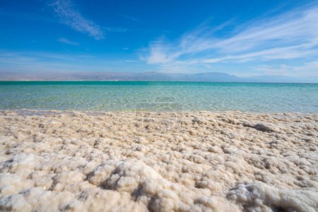 Photo for Receding water level and salt crystallisation due to evaporation on the shores of the Dead Sea, Israel. - Royalty Free Image