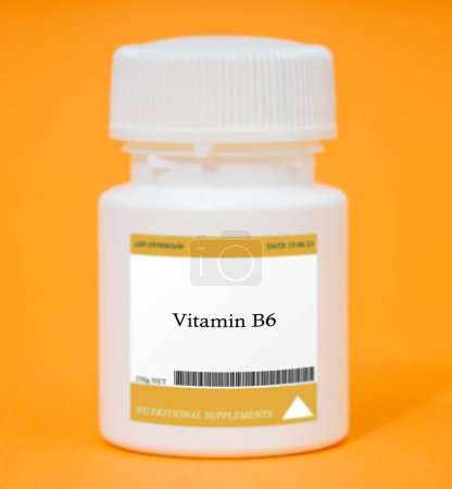 Photo for Container of vitamin B6. Vitamin B6 is important for brain function, nerve health, and red blood cell production. - Royalty Free Image