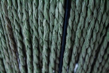 Woven green rope background texture. Close up detail of green woven rope.