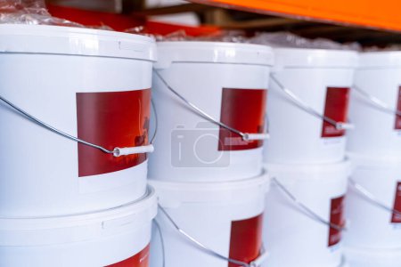 Photo for Factory new white plastic buckets. Factory stack of containers. - Royalty Free Image