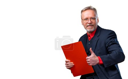 Portrait of a smiling middle aged business man holding folder and showing thumb up. Isolated on white background.