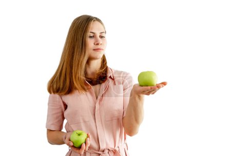 Photo for Woman holding two apples isolated on a white background. Healthy food. Vegans. - Royalty Free Image
