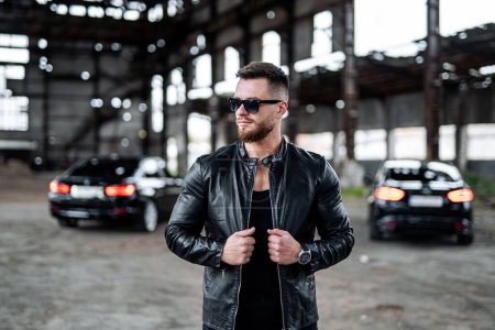 Photo for Brutal successful man in leather jacket. Stylish man in biker black jacket and sunglasses. - Royalty Free Image