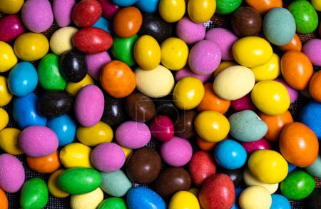 Photo for A Colorful Delight of Candy Eggs Nestled Together. A close up of a pile of candy eggs - Royalty Free Image
