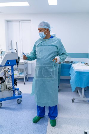 Photo for Doctor in sterile surgery uniform. Operating specialist portrait in work. - Royalty Free Image