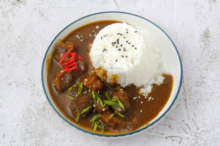 Photo of freshly cooked beef curry with rice.