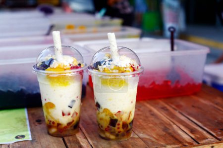 Photo of freshly made Filipino snack and dessert food called Halo Halo made up of shaved ice and assorted sweets.