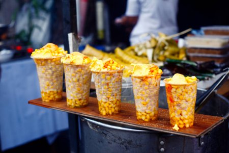 Photo of freshly cooked sweet corn sold at a street food cart.