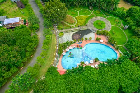 Photo for Aerial view of Eco-tourism area in Dong Nai, Vietnam. A weekend getaway for everyone with forests, rivers, waterfalls, swimming pools. Picnics, camping, and relaxation concept. - Royalty Free Image