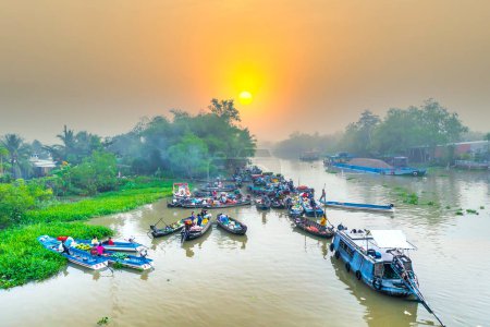 Photo for Can Tho, Vietnam - January 12th, 2023: Farmers purchase crowded in Phong Dien floating market morning trade agricultural products serves traditional New Year in Can Tho, Vietnam - Royalty Free Image