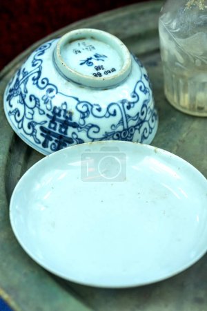 Photo for Household utensils made of old ceramics from the 19th century are displayed in a museum in Binh Duong, Vietnam - Royalty Free Image