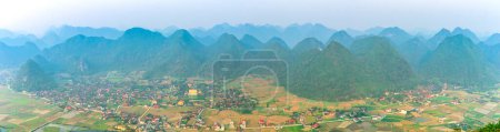 Landscape of Bac Son valley around with houses on pitotis in the village mountains view in Lang Son, Vietnam
