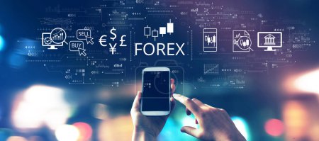 Photo for Forex trading concept with a smartphone in blurred city lights at night - Royalty Free Image