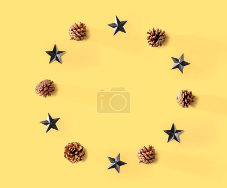 Photo for Christmas pinecones with star ornaments - flat lay - Royalty Free Image