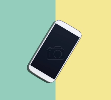 Photo for White smartphone with black screen from above - flat lay - Royalty Free Image