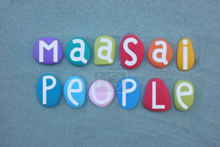 Maasai People, Nilotic ethnic group inhabiting northern, central and southern Kenya and northern Tanzania, near the African Great Lakes region, creative logo composed with multi colored stone letters over green sand