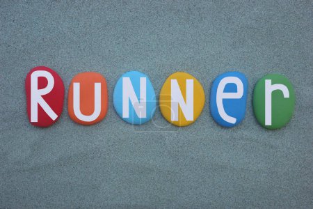 Runner, a person that runs, especially in a specified way, creative word composed with hand painted colored stone letters over green sand