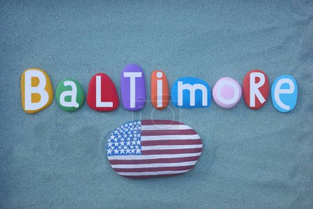 Baltimore the most populous city in the U.S. state of Maryland, souvenir composed with hand painted multi colored stone letters over green sand