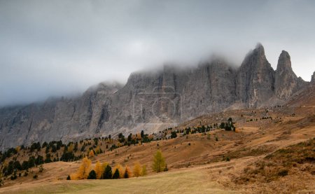 Photo for Mountain landscape of dolomites covered with fog Italian alps in autumn. Nature scenery Italy. Passo Sella South tyrol - Royalty Free Image
