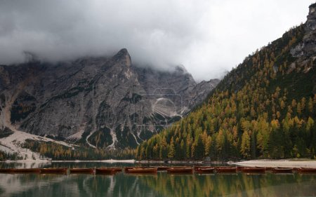 Photo for Wooden boats and Lago di Braies in Dolomites, and seekofel dolomite massif in Italy Europe. - Royalty Free Image