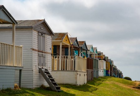 Colorful holiday beach huts. Vacations coastal wooden houses. Whitstable, Kent South East England