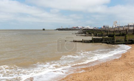 Whitstable coast line and wooden breakwater. Kent United Kingdom.