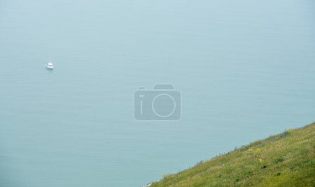Nature landscape. Green hill and ocean. Edge of cliff.