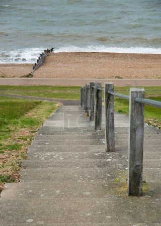 Staircase access to the beach coast. Pedestrian walk path. Whitstable coastline Kent England