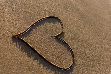 Photo for Heart shape drawn in the sand on a beach - Royalty Free Image