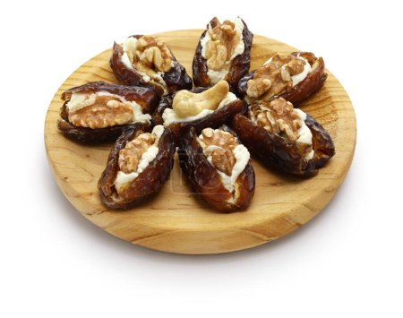 stuffed dates with cream cheese and nuts isolated on white background